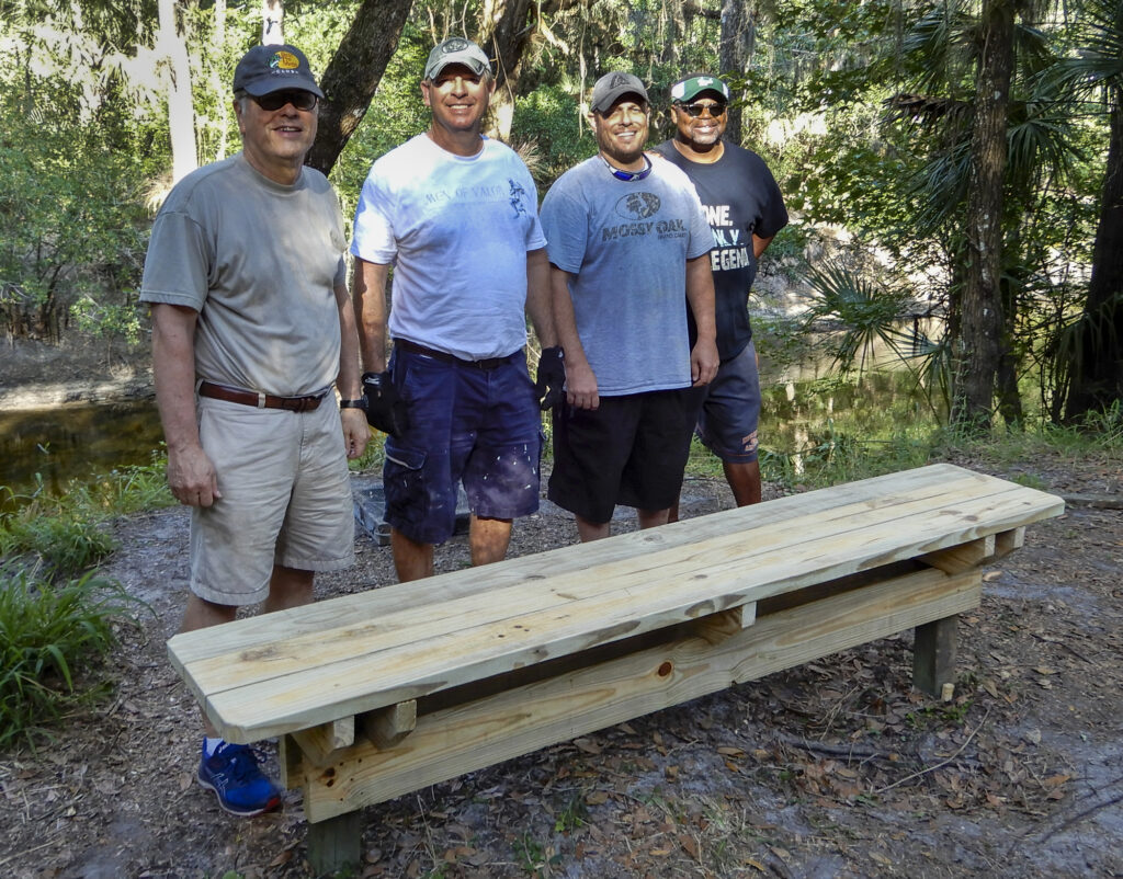 Volunteer crew with the newly rebuilt Big Bench overlooking the Alafia River